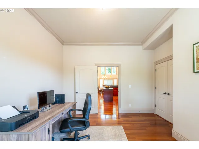a workspace with furniture and wooden floor