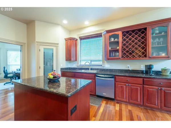 a kitchen with sink and cabinets