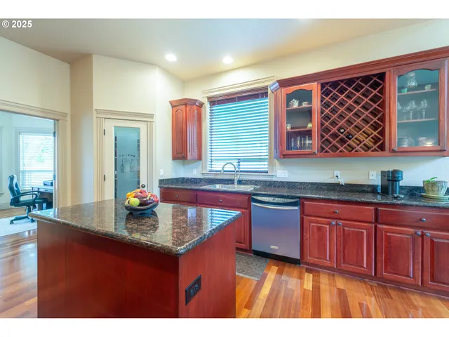 a kitchen with sink and cabinets