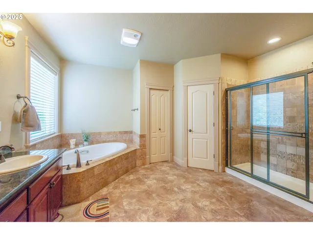 a bathroom with a granite countertop sink mirror and double