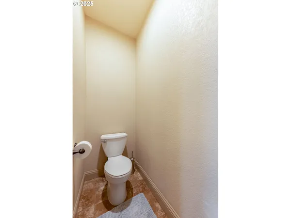 a bathroom with a toilet and a sink