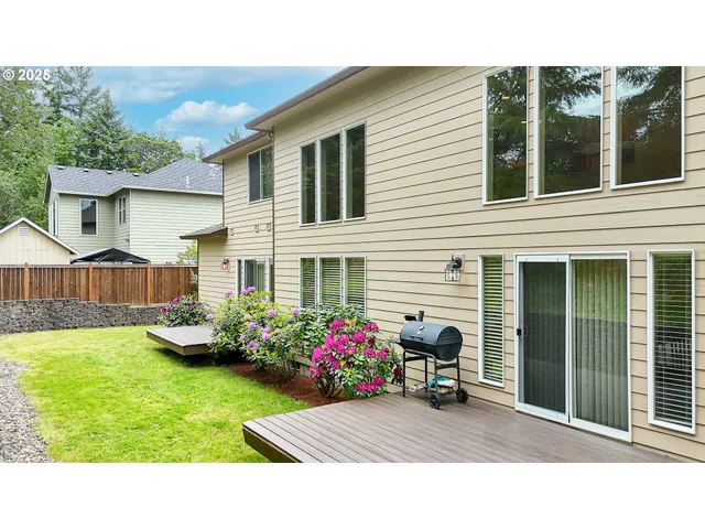 a view of a house with backyard tub and garden