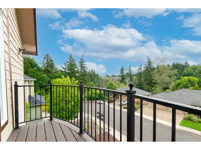 a view of balcony with wooden floor
