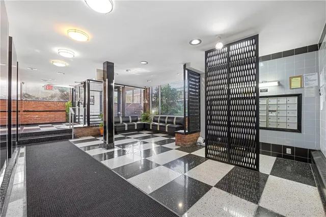 a view of lobby with a floor to ceiling window and glass door