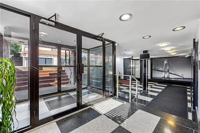 a room with gym equipment and a large window