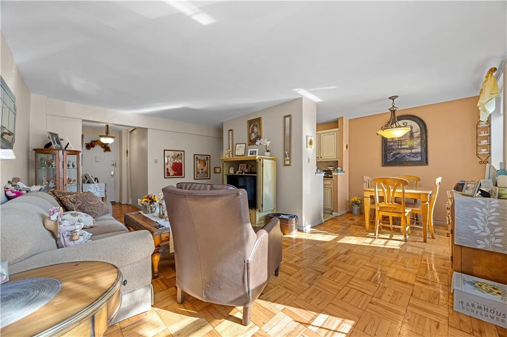 6901 Narrows Avenue, Unit 1C Brooklyn, NY 11209 - Photo 6 of 22 a living room with furniture and a flat screen tv