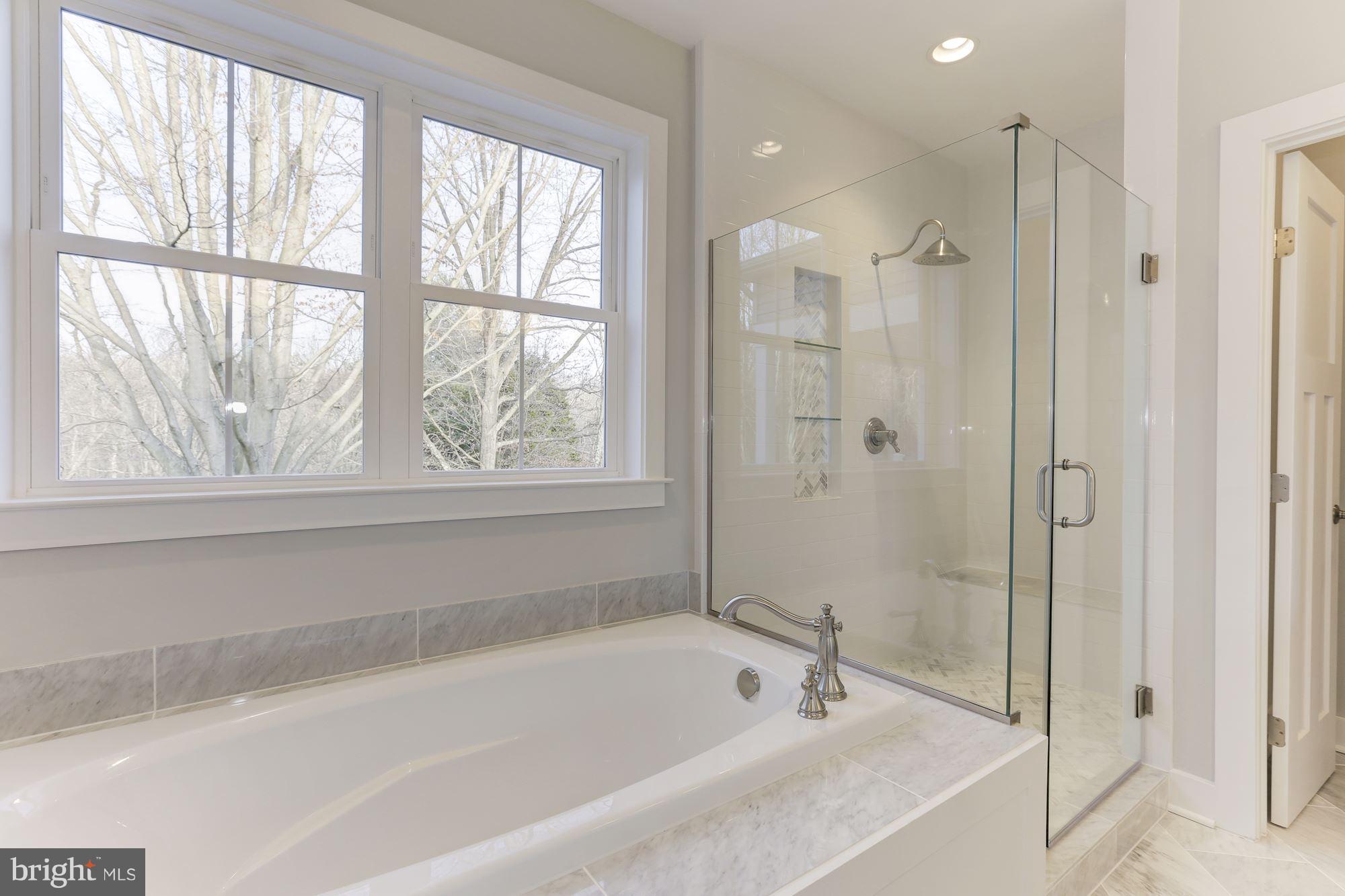 11613 Popes Head Road Fairfax, VA 22030 - Photo 18 of 30 Separated Frameless Shower and Soaking Tub