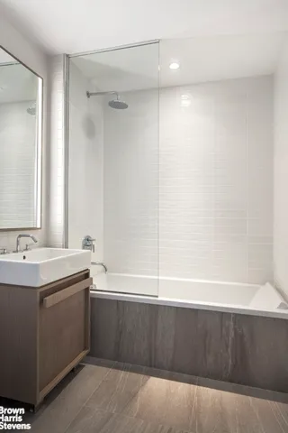 a bathroom with a bathtub and a sink