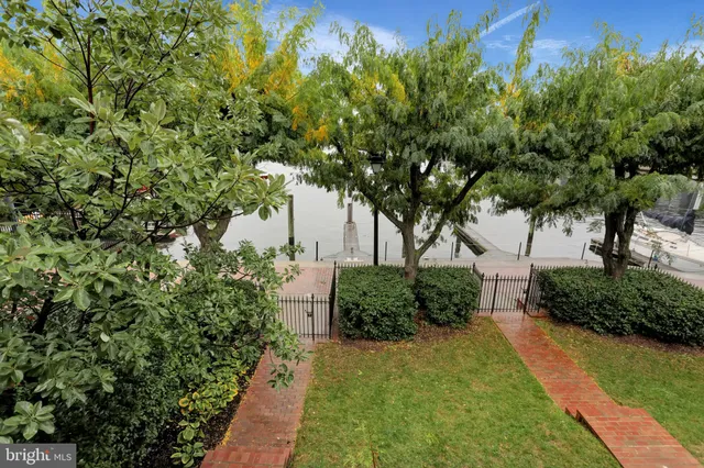 a view of a balcony with a table and chairs