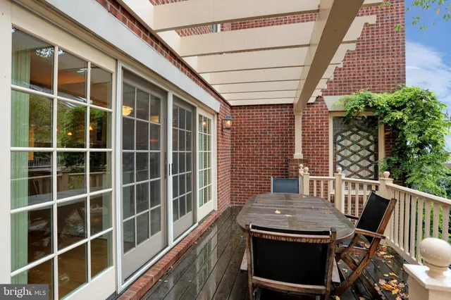 a view of a chairs and table in the balcony