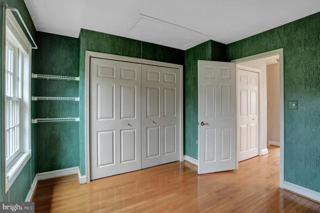 a view of a livingroom with an empty space and a window