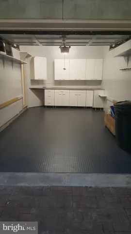 a view of a house with large windows and a small yard