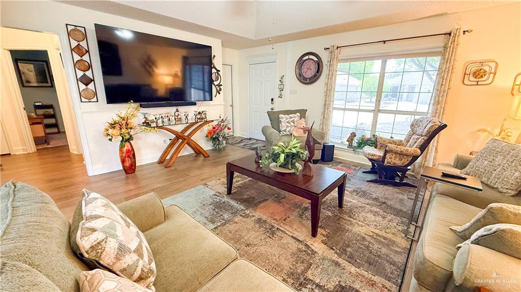 518 Taurus Street Mission, TX 78572 - Photo 2 of 20 a living room with furniture and a flat screen tv