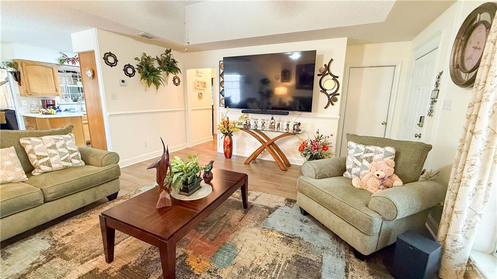 518 Taurus Street Mission, TX 78572 - Photo 3 of 20 a living room with furniture and a flat screen tv