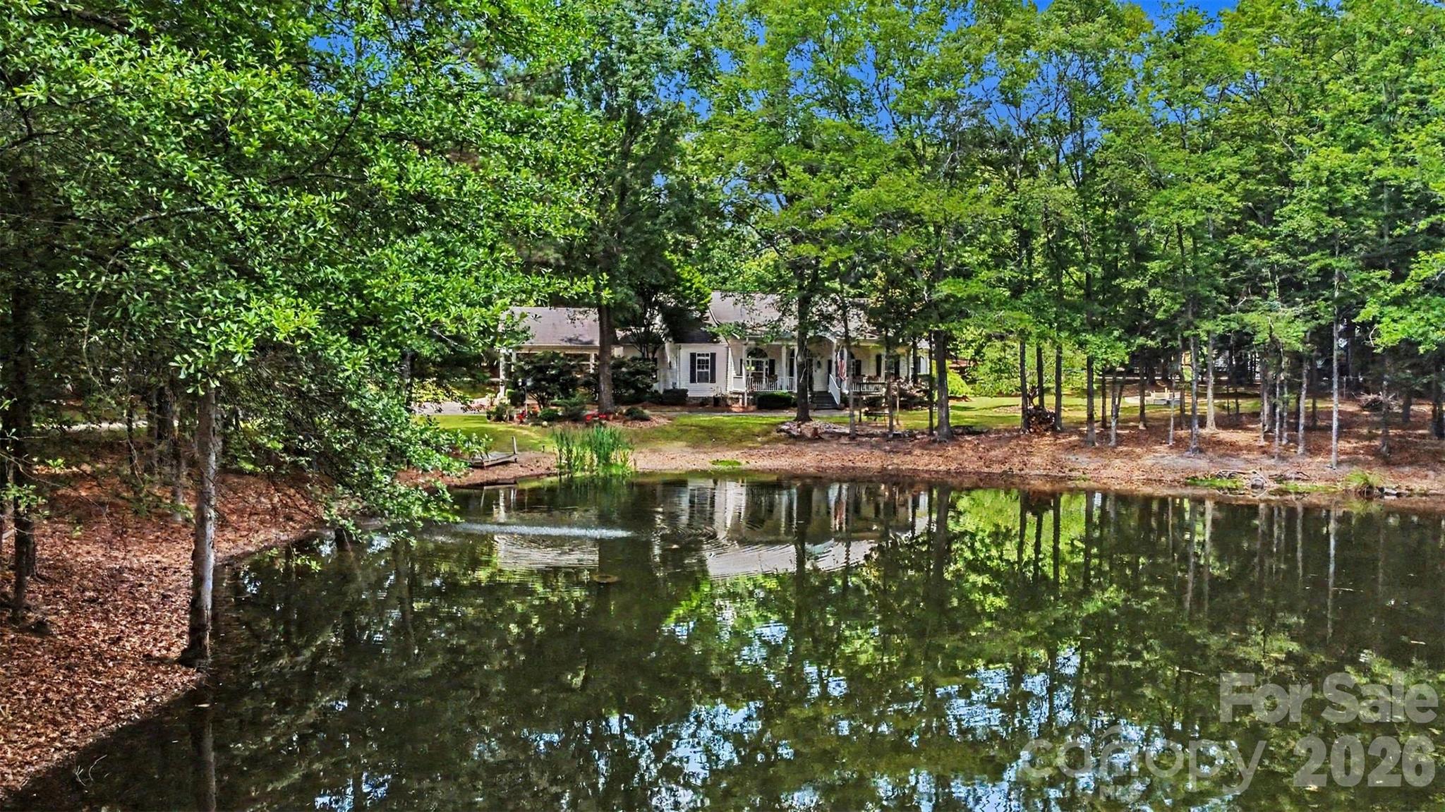 4037 Old Williamston Road Belton, SC 29627 - Photo 37 of 41 a view of swimming pool with outdoor seating and trees