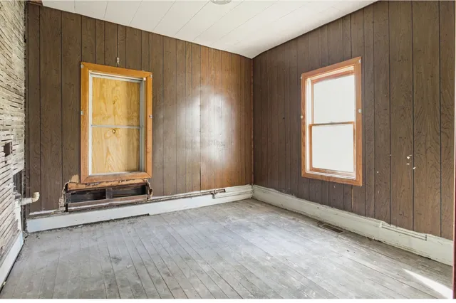 a view of a room with furniture and windows