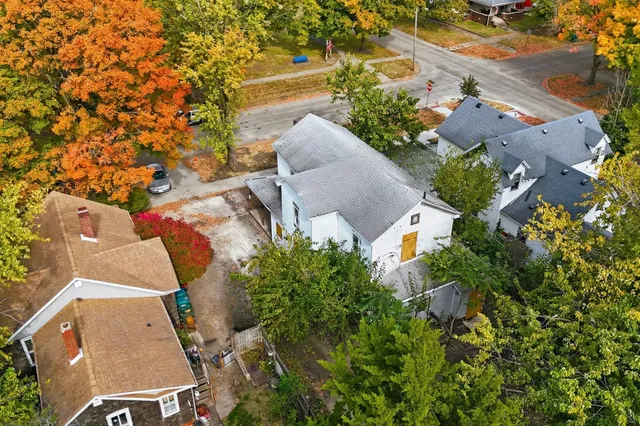 an aerial view of a house with outdoor space