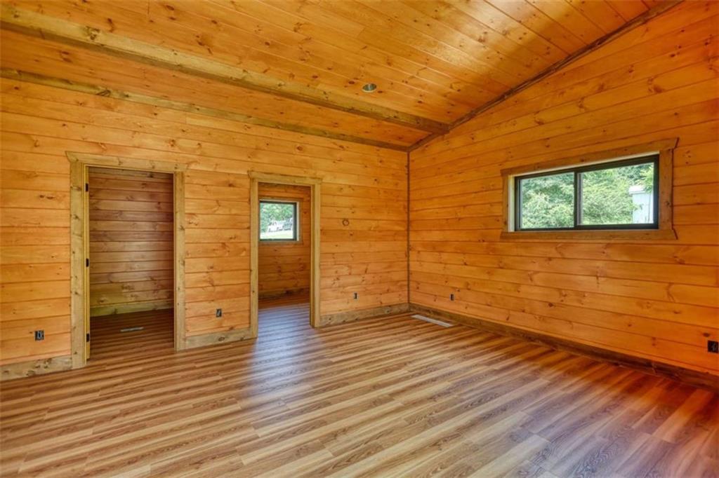 485 Church Street Blue Ridge, GA 30513 - Photo 73 of 85 a view of an empty room with wooden floor and a window