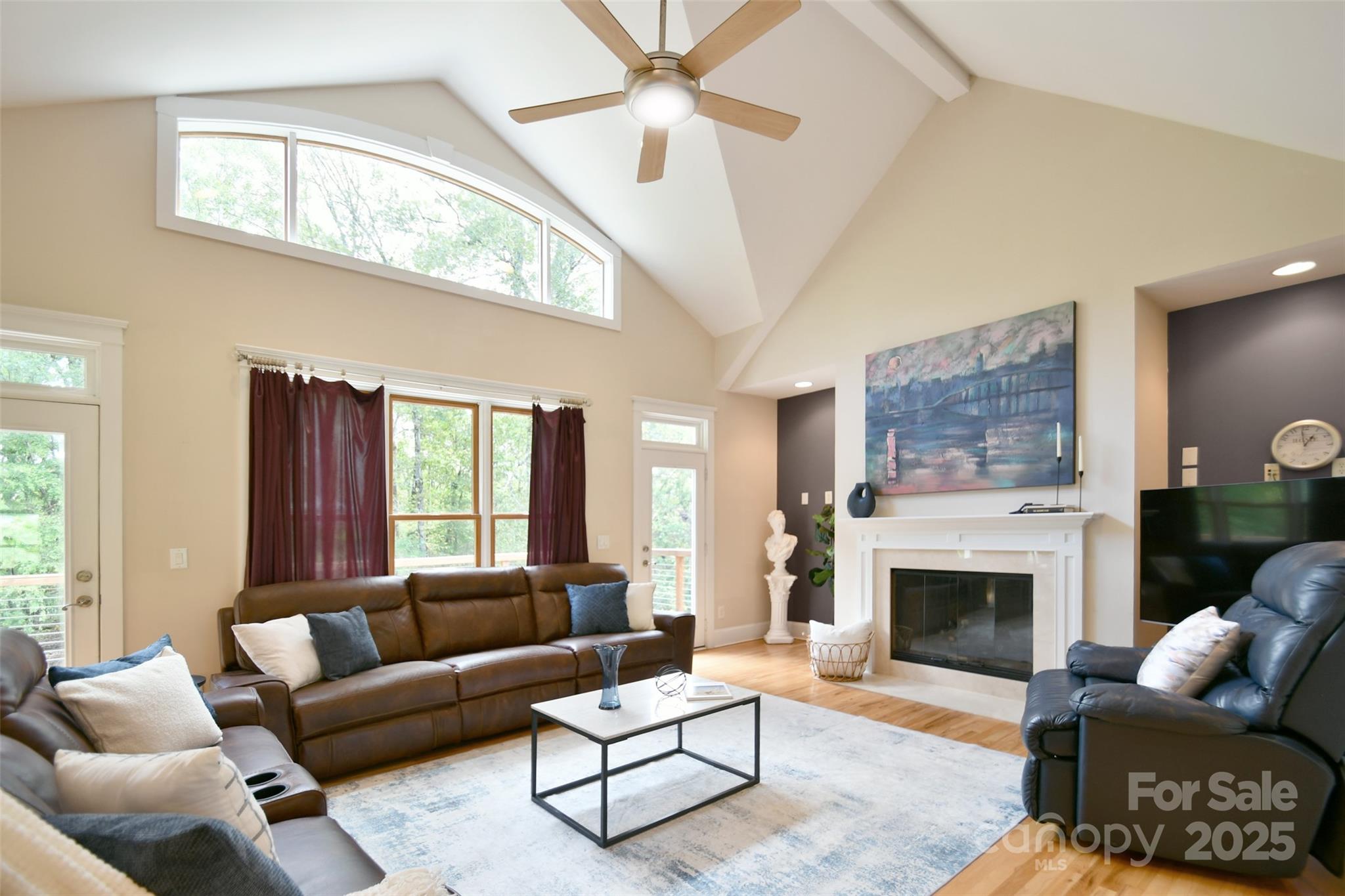 14832 Hus McGinnis Road Huntersville, NC 28078 - Photo 14 of 48 a living room with furniture a fireplace and a large window