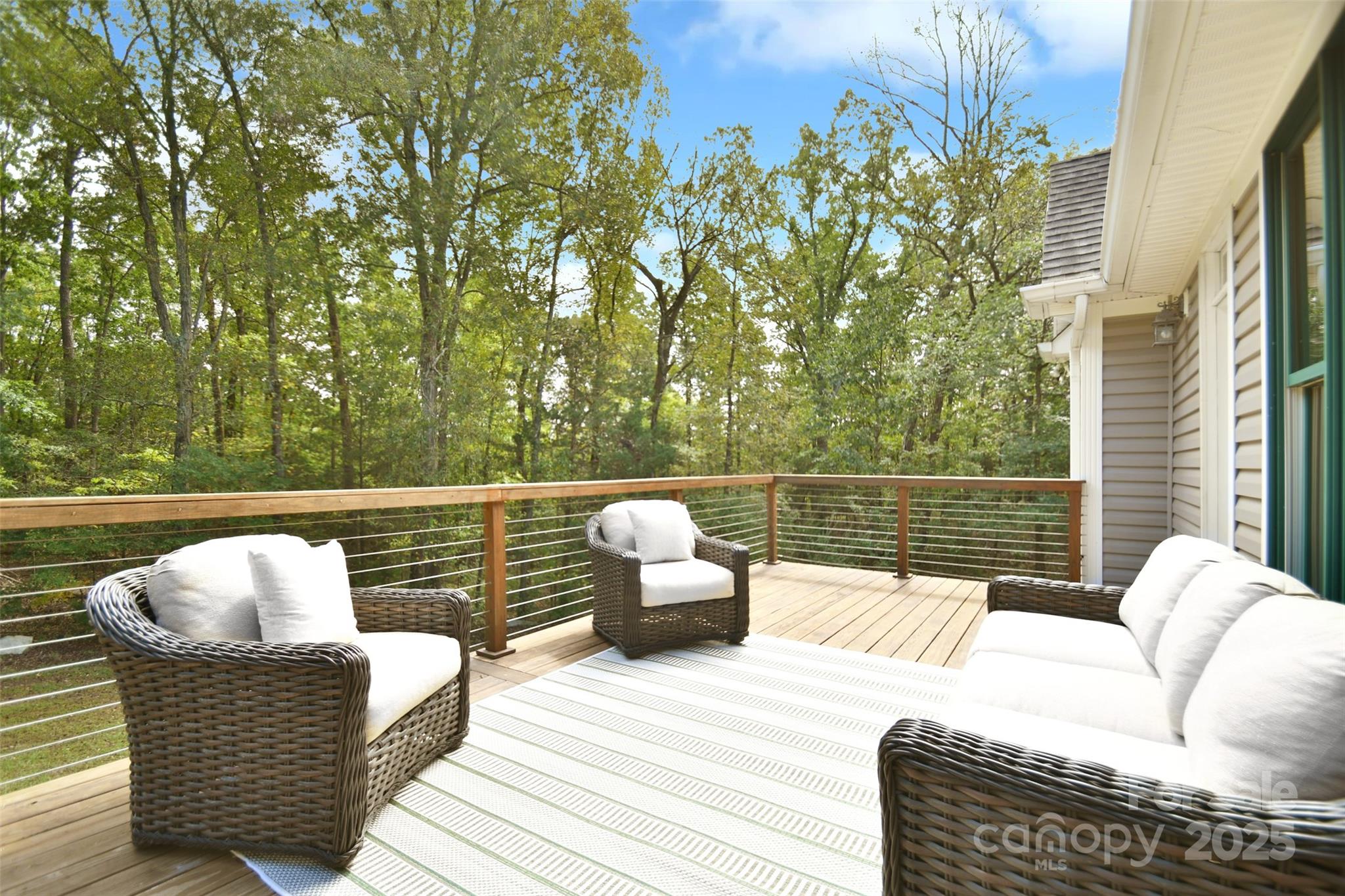 14832 Hus McGinnis Road Huntersville, NC 28078 - Photo 17 of 48 a balcony with furniture and a garden