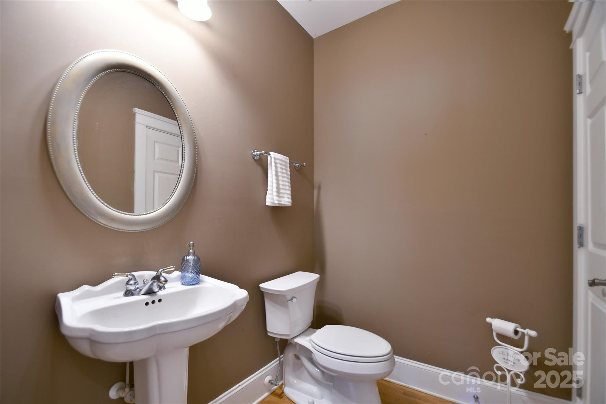 14832 Hus McGinnis Road Huntersville, NC 28078 - Photo 20 of 48 a bathroom with a sink and a mirror