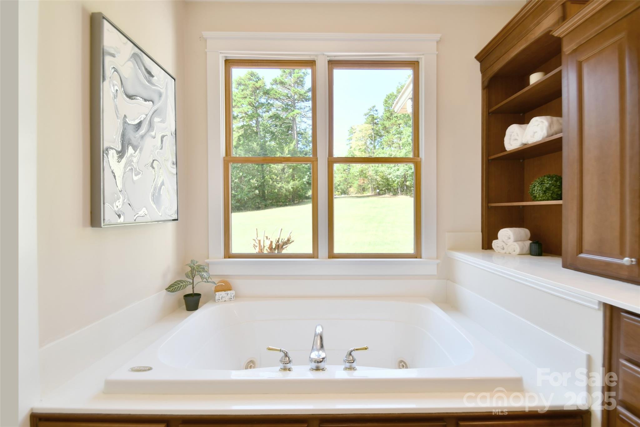14832 Hus McGinnis Road Huntersville, NC 28078 - Photo 24 of 48 a white bath tub sitting in a bathroom next to a window