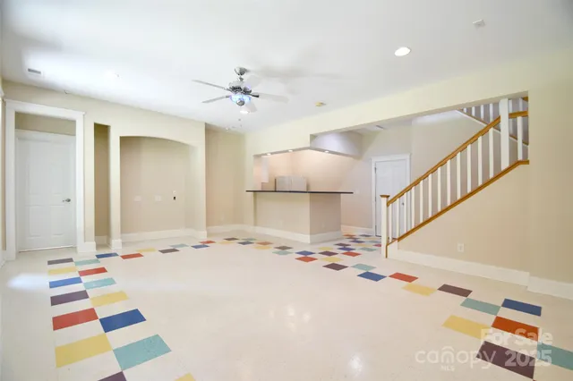 a very nice looking bedroom with a bed and a chandelier