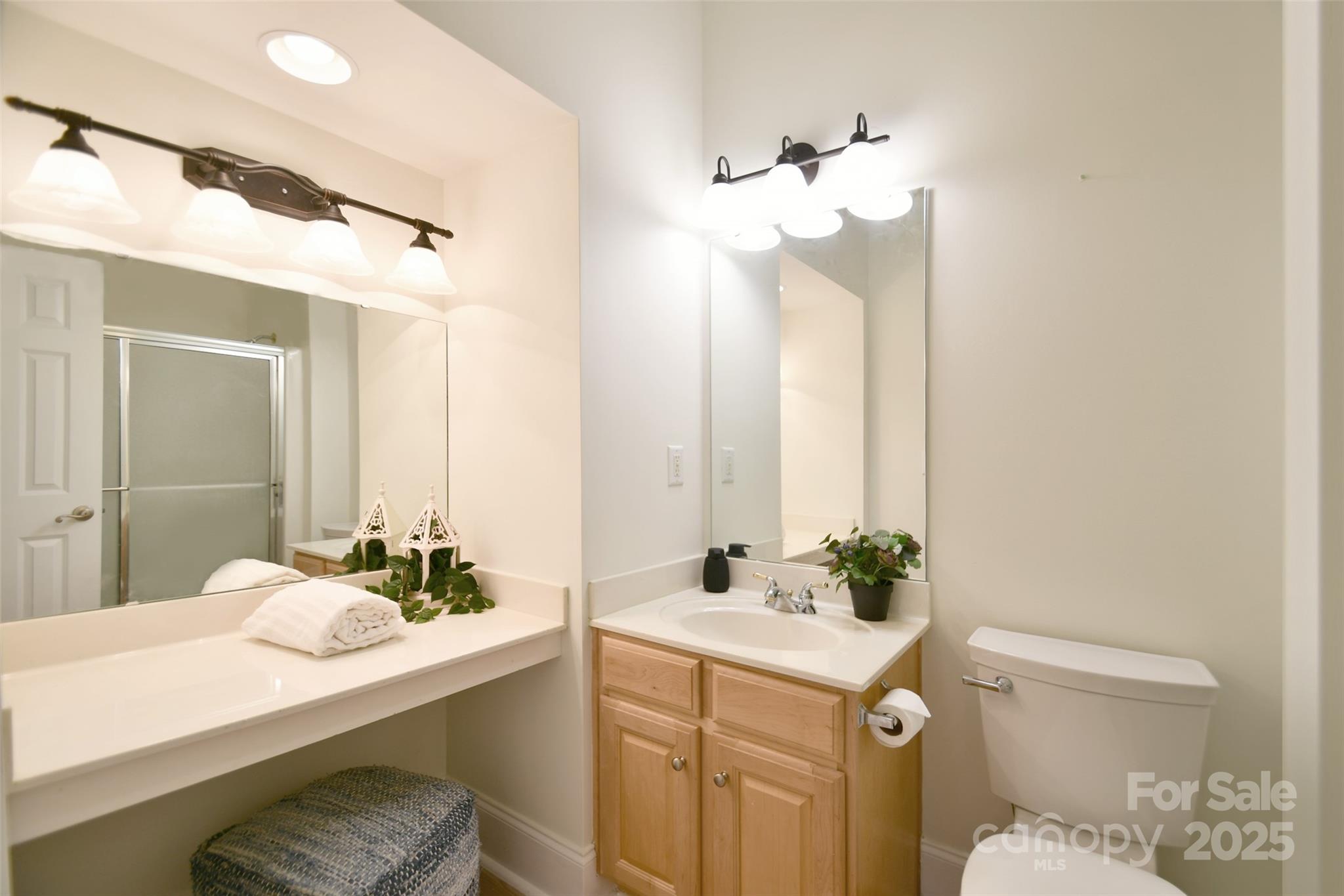 14832 Hus McGinnis Road Huntersville, NC 28078 - Photo 34 of 48 a bathroom with a sink and a mirror