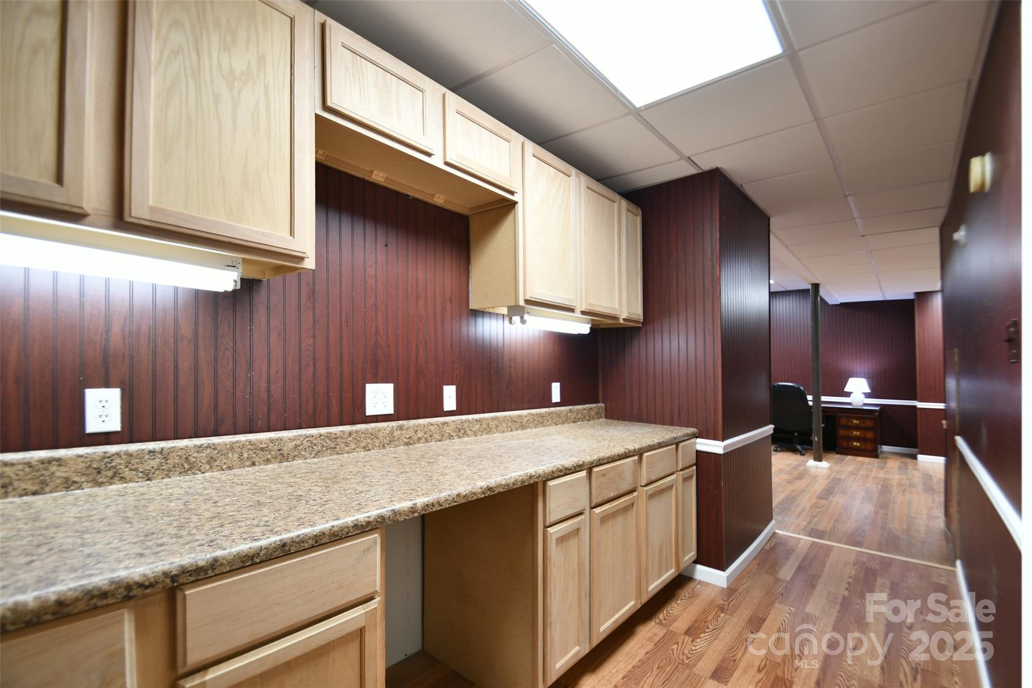14832 Hus McGinnis Road Huntersville, NC 28078 - Photo 39 of 48 a kitchen with stainless steel appliances granite countertop a sink a stove and a wooden cabinets