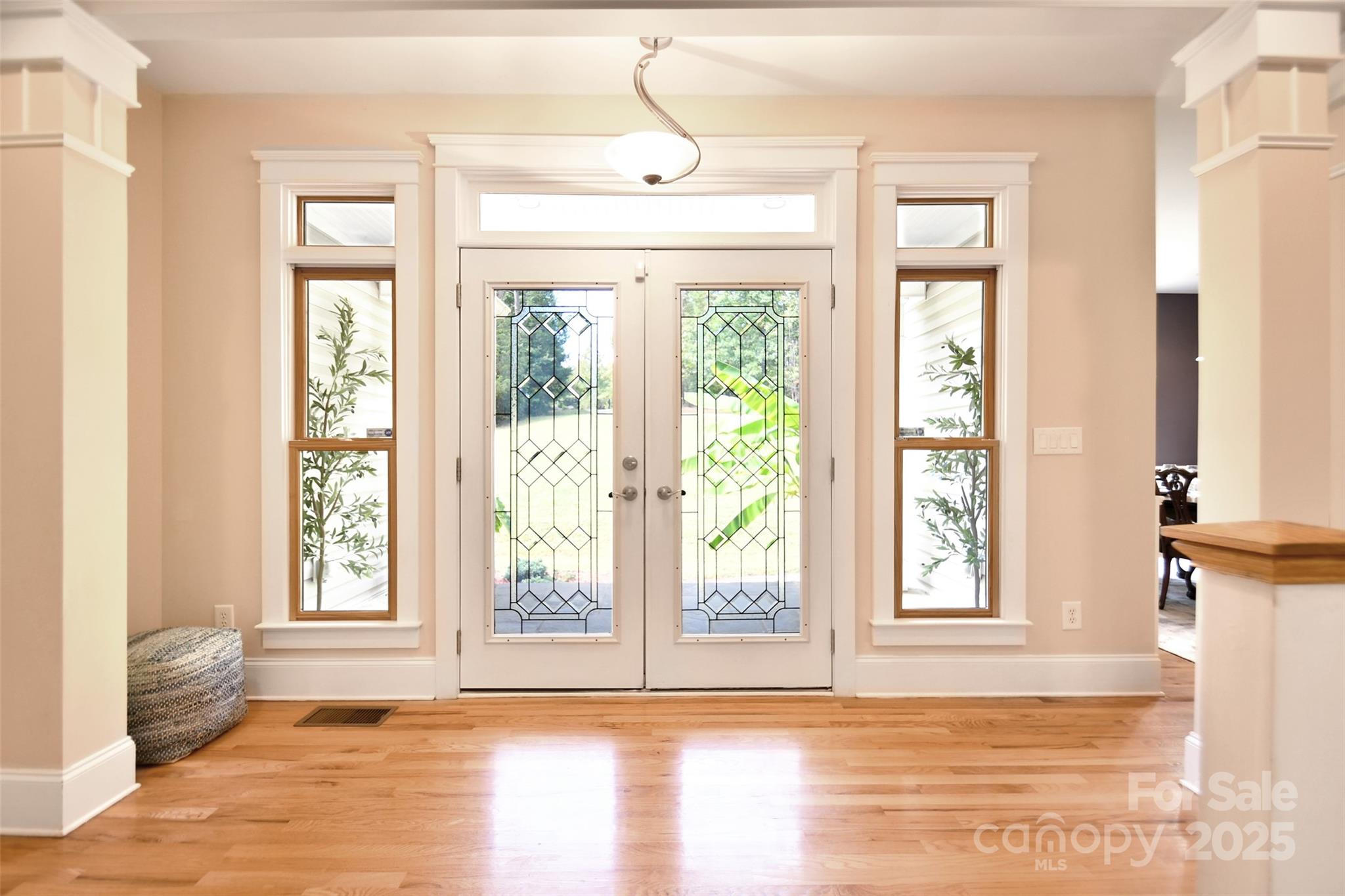 14832 Hus McGinnis Road Huntersville, NC 28078 - Photo 4 of 48 a view of empty room with wooden floor and fan