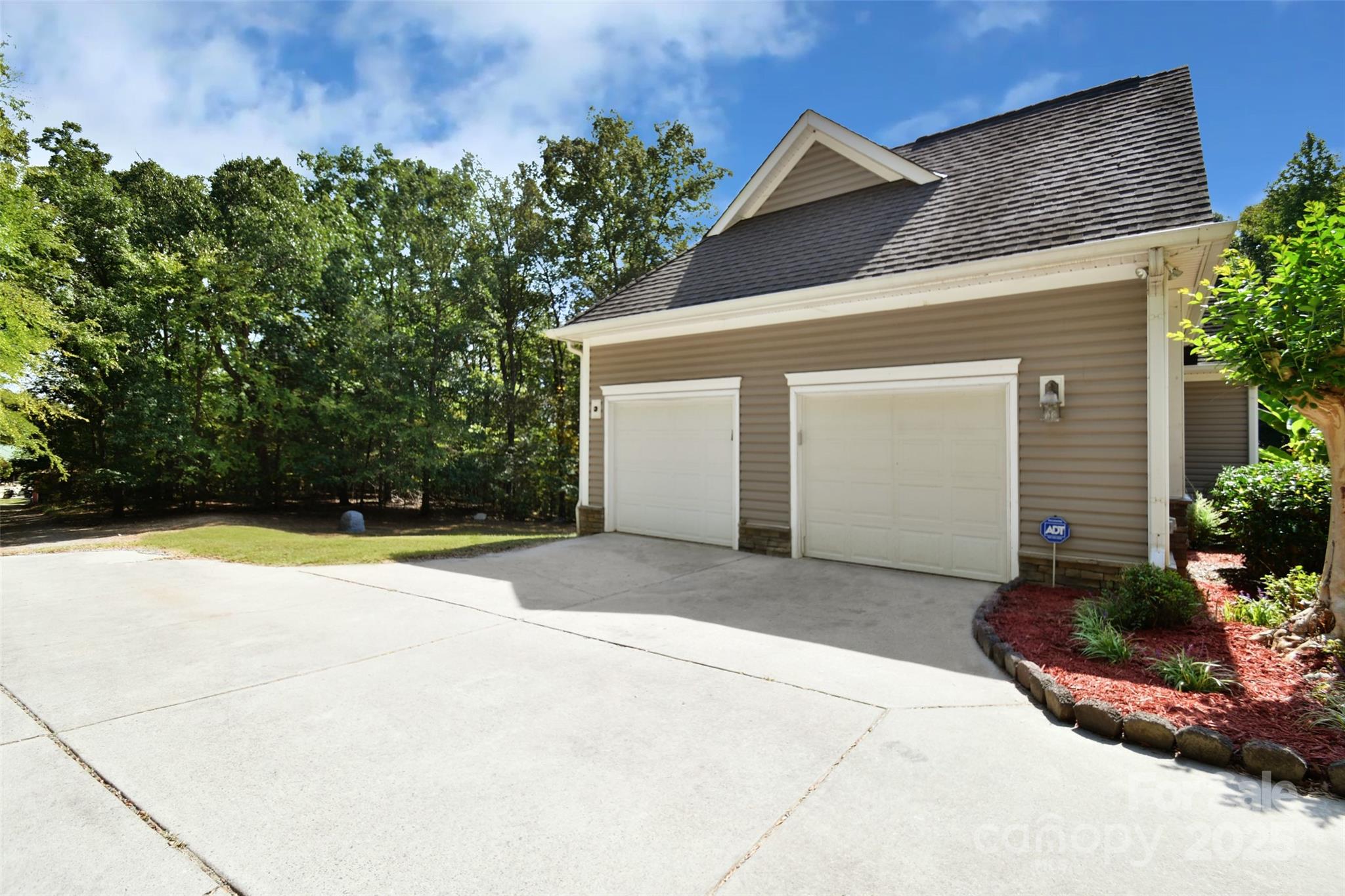 14832 Hus McGinnis Road Huntersville, NC 28078 - Photo 44 of 48 a view of a house with a yard and potted plants