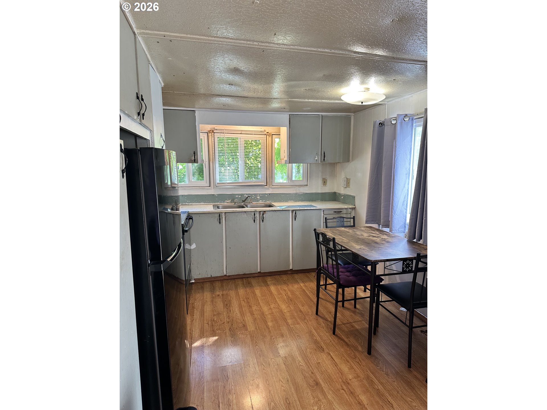 37635 Row River Road, Unit 7 Dorena, OR 97434 - Photo 8 of 27 a kitchen with a sink cabinets and window