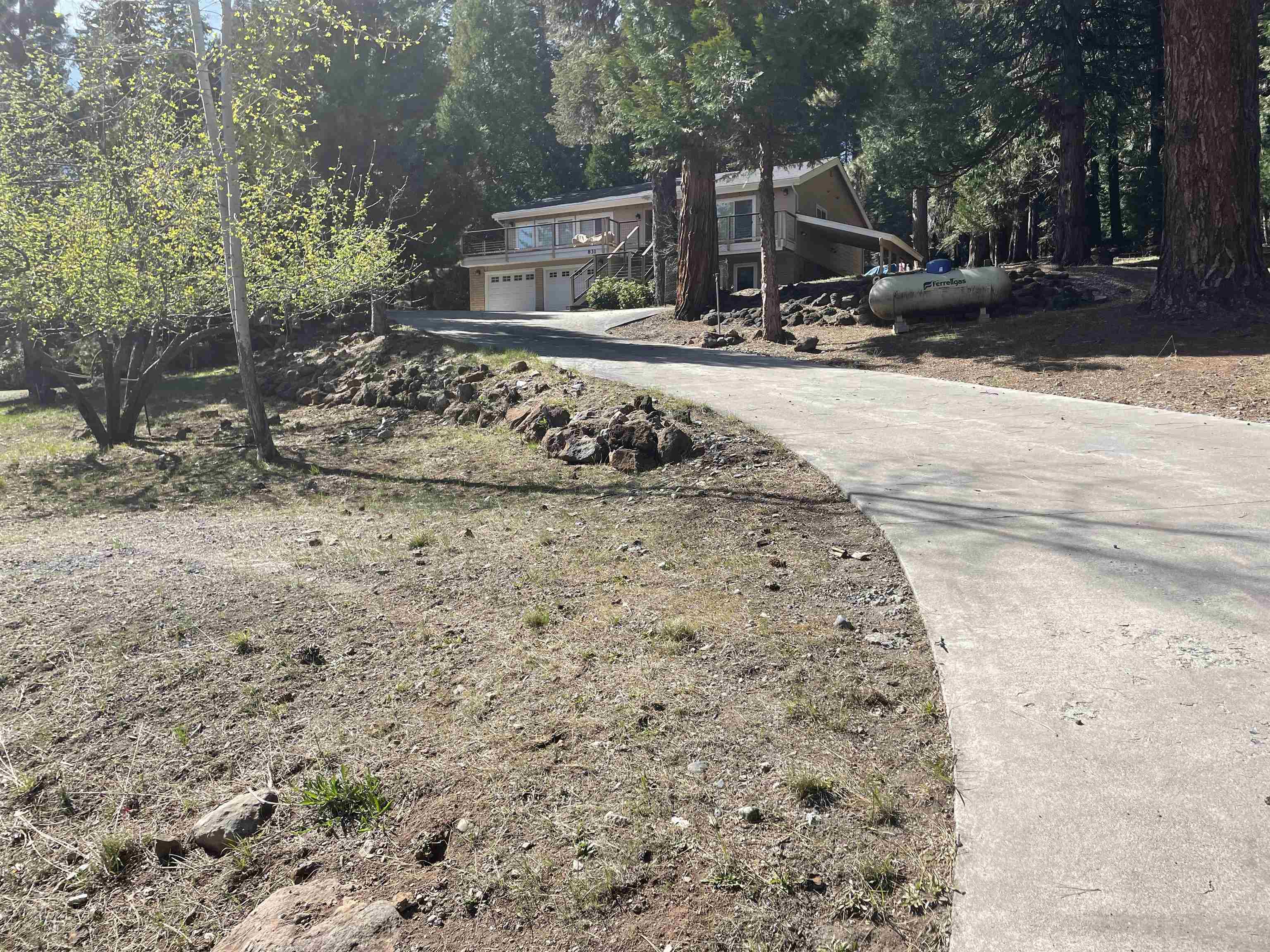 831 Timber Ridge Road Lake Almanor, CA 96137 - Photo 35 of 36 a view of a house with a yard covered in snow