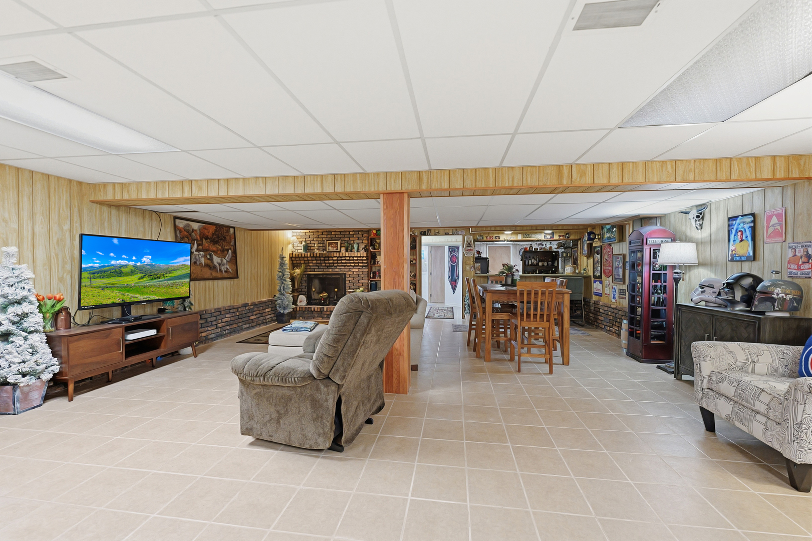 27805 South Klemme Road Crete, IL 60417 - Photo 26 of 29 a living room with furniture a flat screen tv and floor to ceiling window