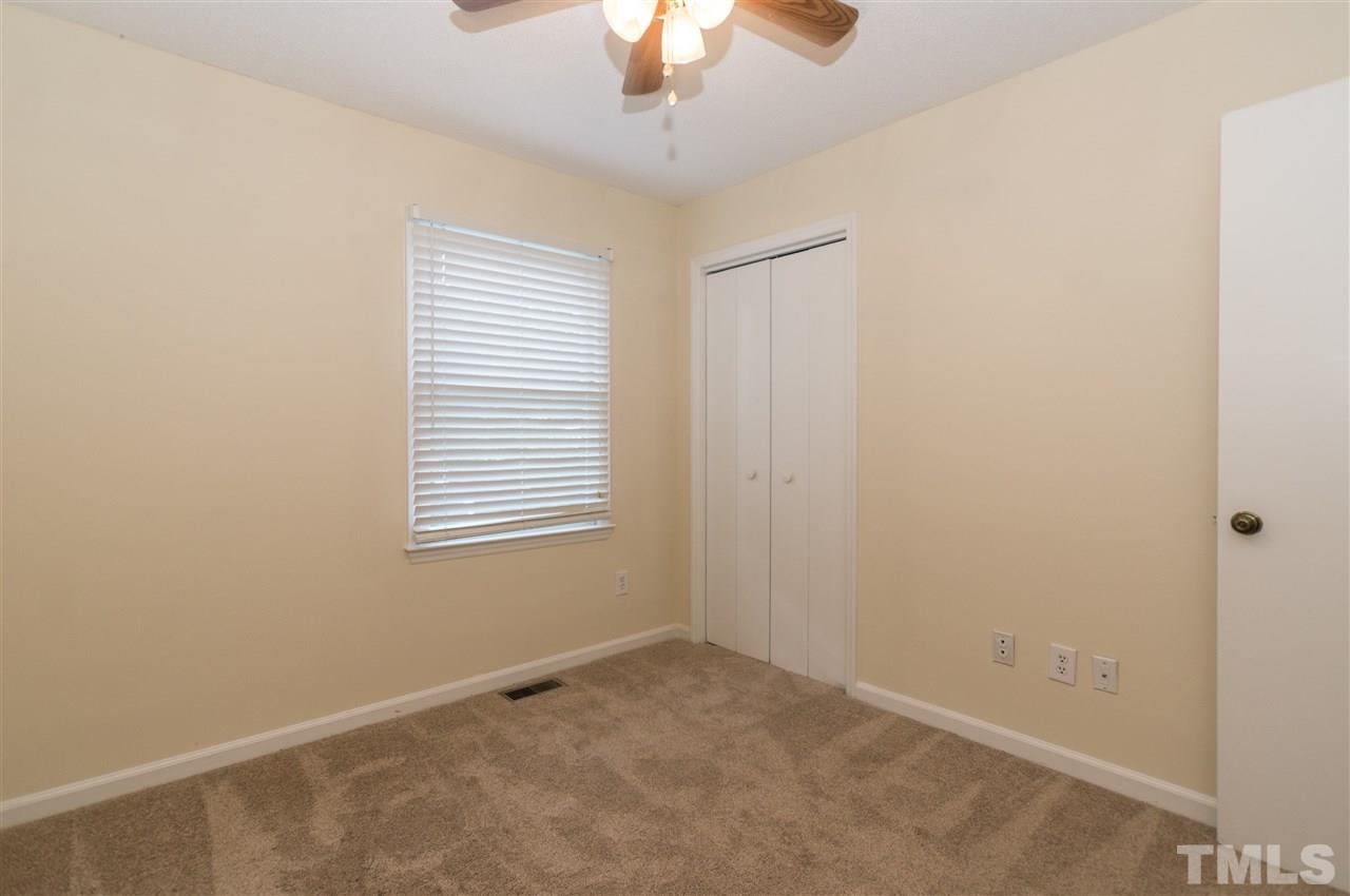 6812 Glendower Road Raleigh, NC 27613 - Photo 14 of 23 a view of an empty room with a window