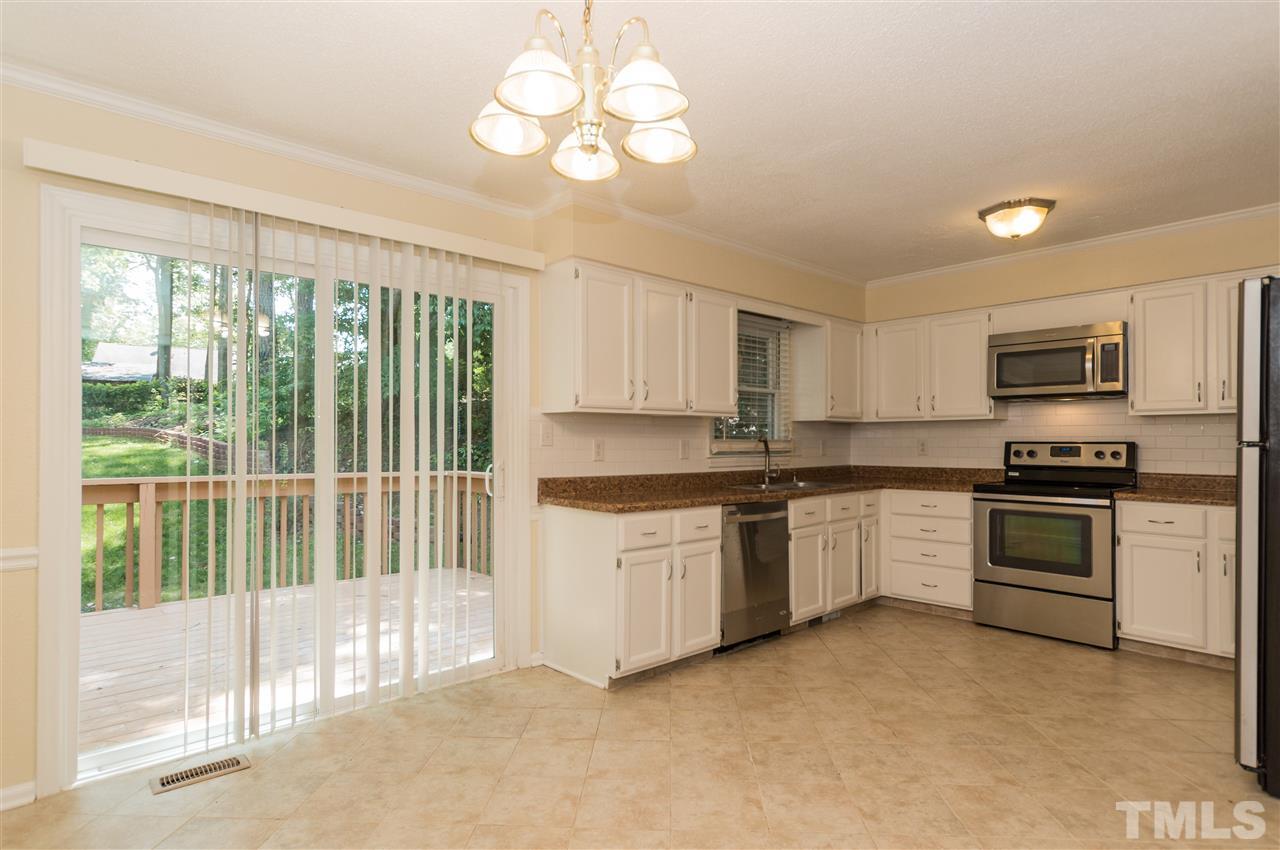 6812 Glendower Road Raleigh, NC 27613 - Photo 5 of 23 a kitchen with a sink stove and microwave