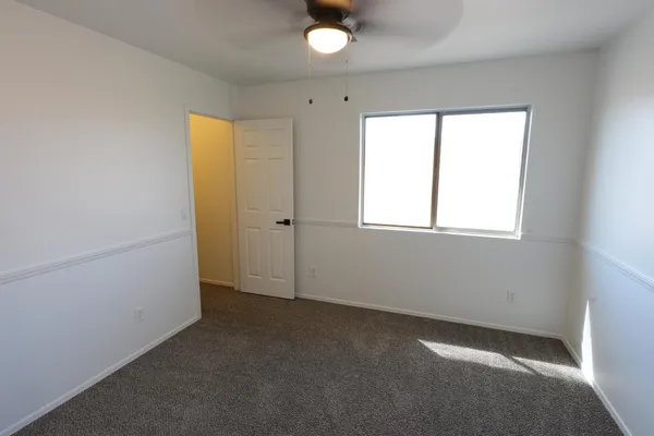a view of an empty room with a window