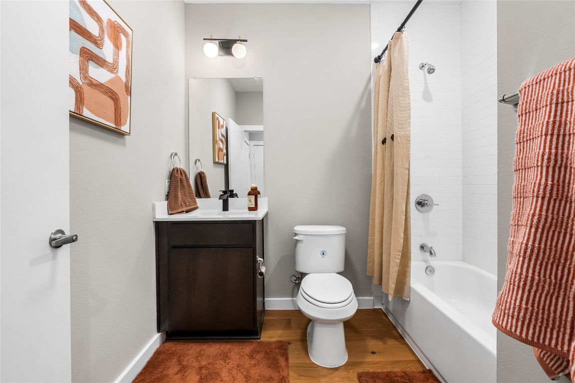 2505 Thornton Road, Unit 2208 Austin, TX 78704 - Photo 6 of 23 a bathroom with a sink toilet and shower