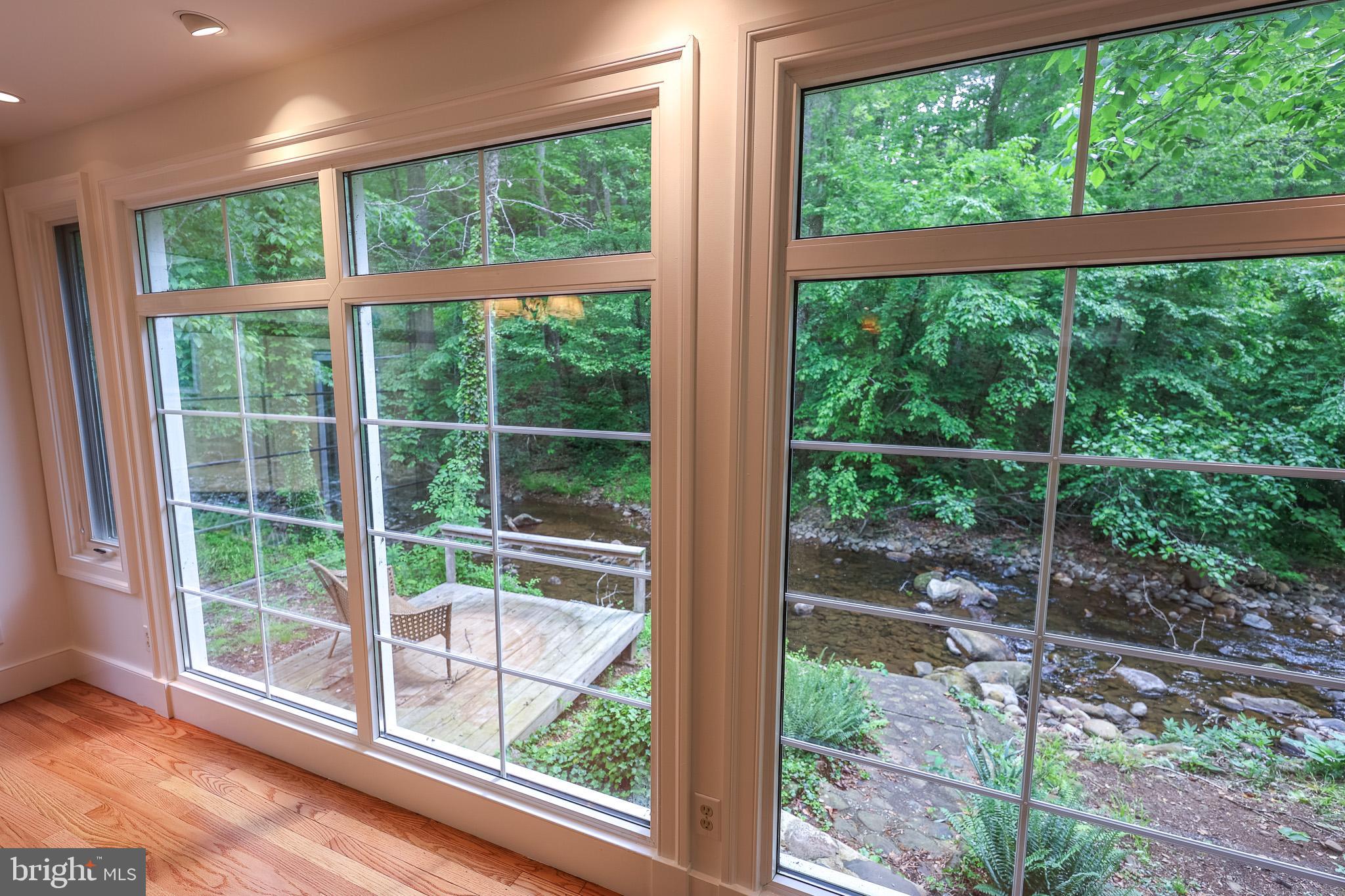 98 Swindler Hollow Road Sperryville, VA 22740 - Photo 2 of 25 a view of a room with a large window and wooden floor