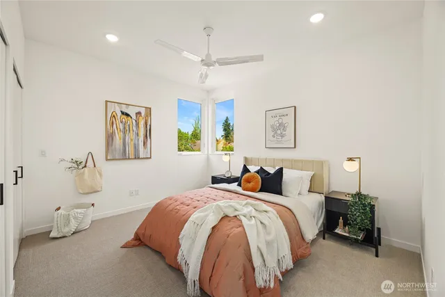 a bedroom with a bed and ceiling fan