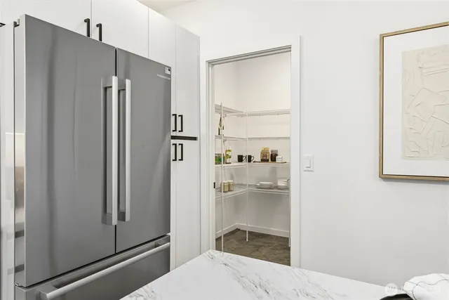 a bathroom with a shower and a sink