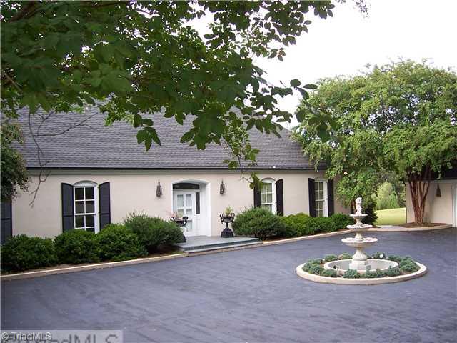 235 Cascade Drive High Point, NC 27265 - Photo 1 of 13 Exterior Front. The entry features a courtyard / driveway with a charming center fountain. The detached garage has a workshop and full bath.