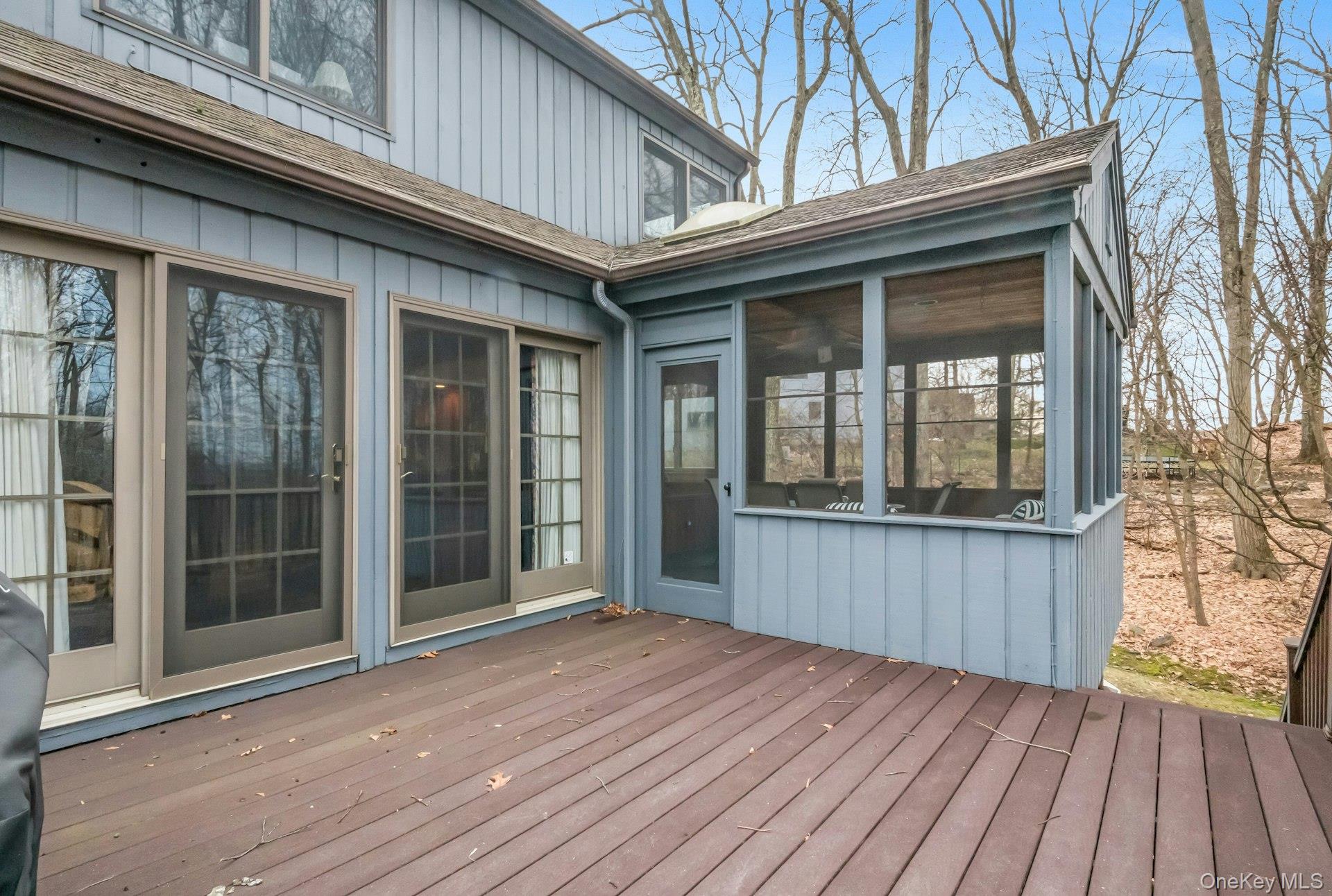 121 Law Road Briarcliff Manor, NY 10510 - Photo 16 of 48 The Deck and Screened Porch connect via a door on the outside. There are steps down to the yard from the deck.