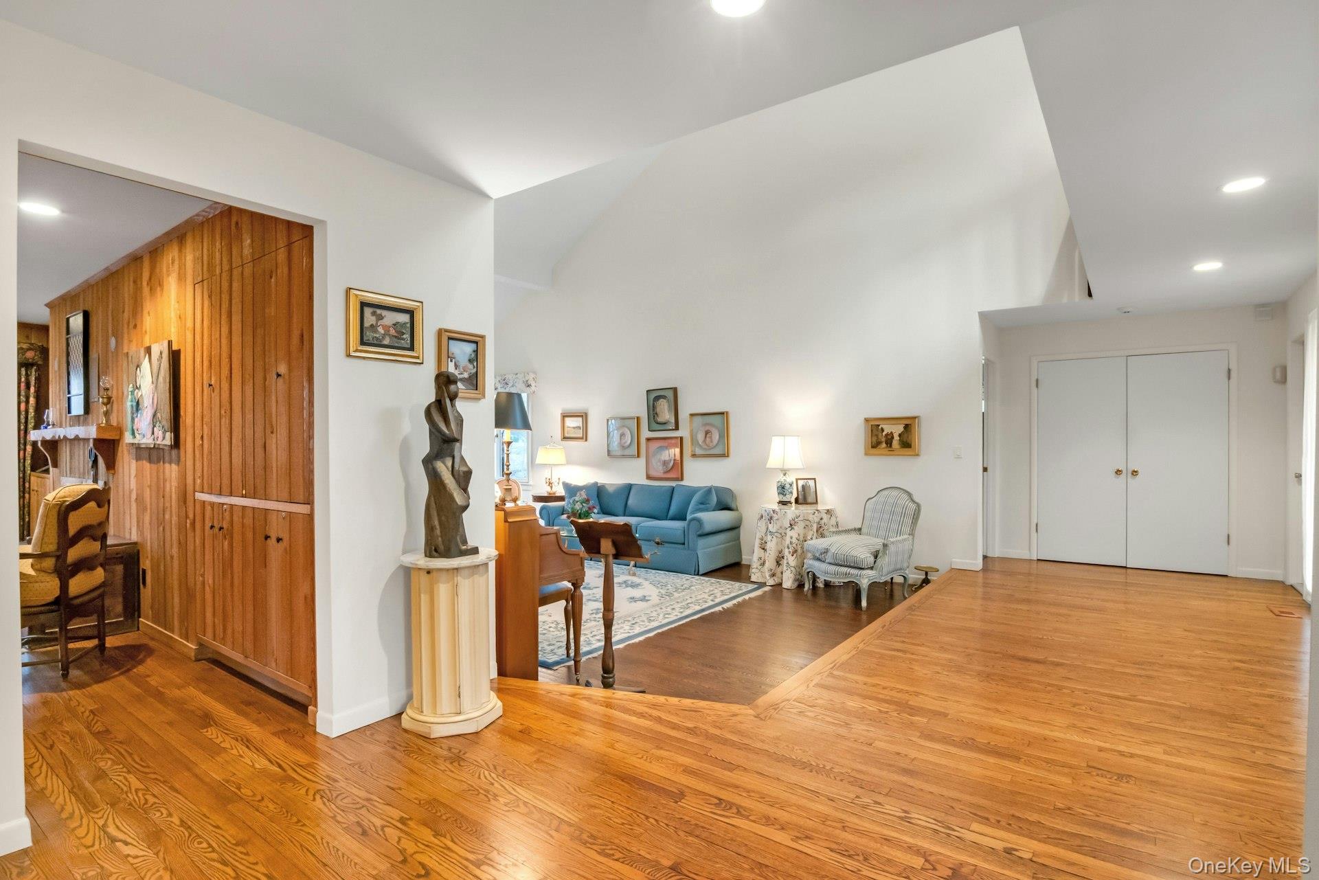 121 Law Road Briarcliff Manor, NY 10510 - Photo 20 of 48 Back to the Entry Foyer: Hidden behind the near wall of the Family Room is a built in bar area-great for entertaining. Down the hall is a large double coat closet and the Powder Room on the right. To the left of the closets is the Primary Suite-a perfect location for privacy.