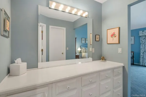 a bedroom with a bed and a cabinets