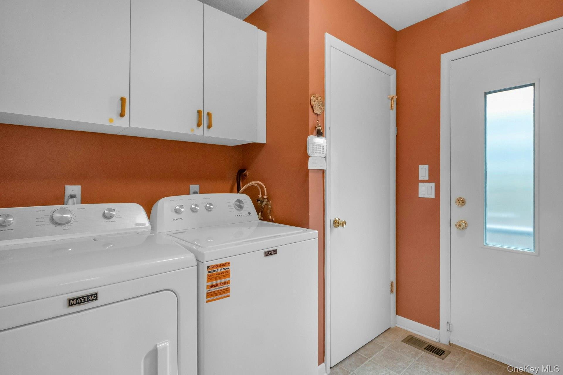 121 Law Road Briarcliff Manor, NY 10510 - Photo 26 of 48 The Laundry Room is conveniently located off of the kitchen and has a side door exit to the driveway. A great mudroom space with its own closet and storage cabinets.