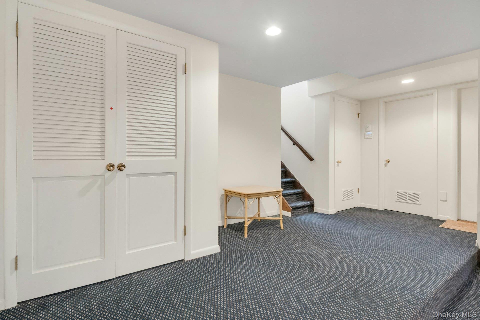 121 Law Road Briarcliff Manor, NY 10510 - Photo 34 of 48 Staircase down to Lower level landing with loads of closets/storage areas.