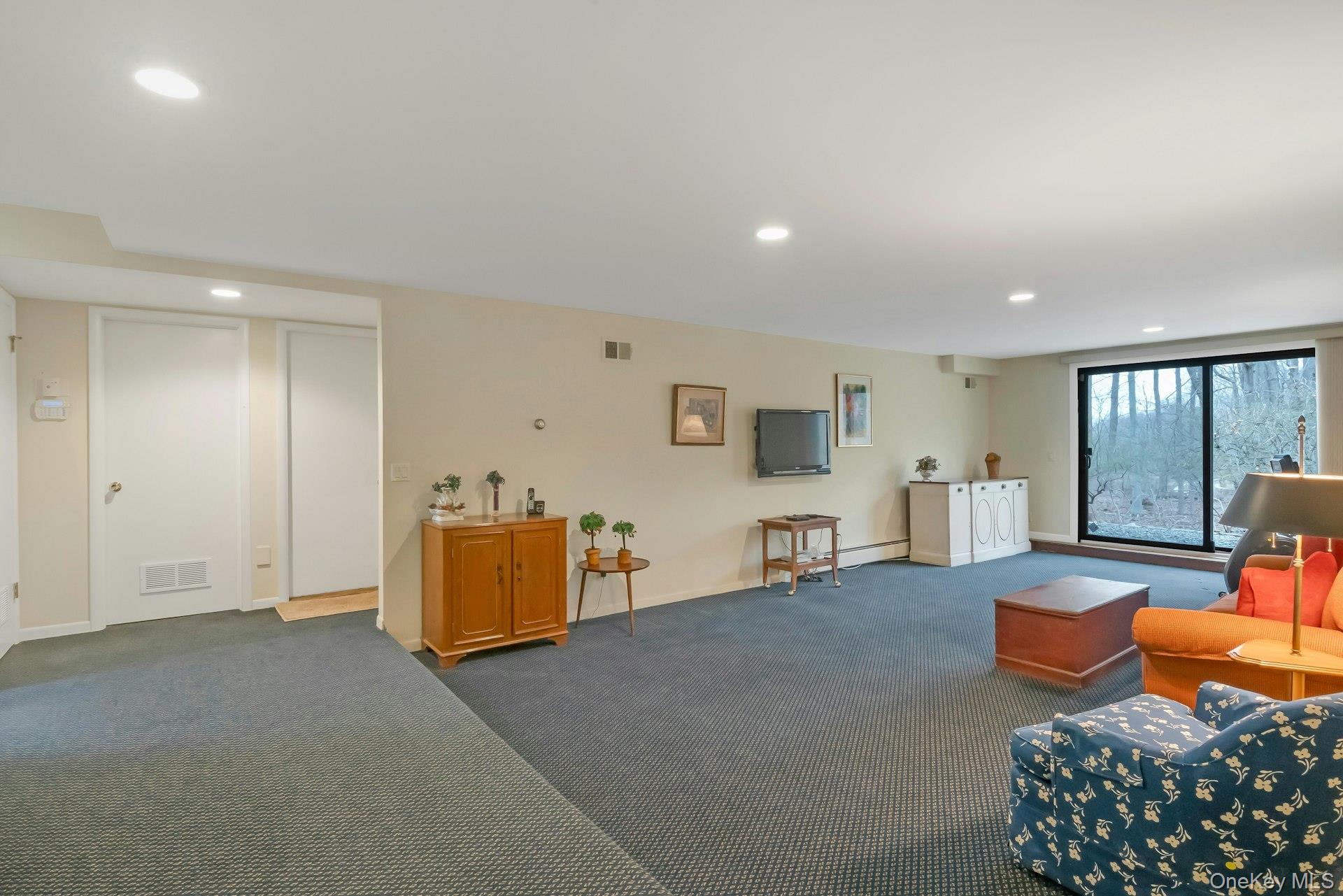 121 Law Road Briarcliff Manor, NY 10510 - Photo 35 of 48 Walk-out Lower Level with large Recreation Room, a Fifth BR/Bathroom Suite, multiple storage & mechanical rooms, cedar closet and door to 2 car garage.