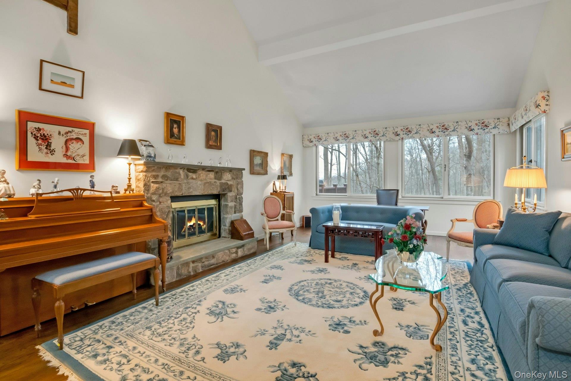 121 Law Road Briarcliff Manor, NY 10510 - Photo 4 of 48 The generously-sized Living Room boasts high ceilings a wall of windows overlooking the backyard and a stone-surrounded wood-burning Fireplace.