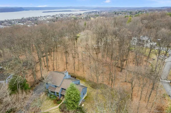 an aerial view of a houses with a yard